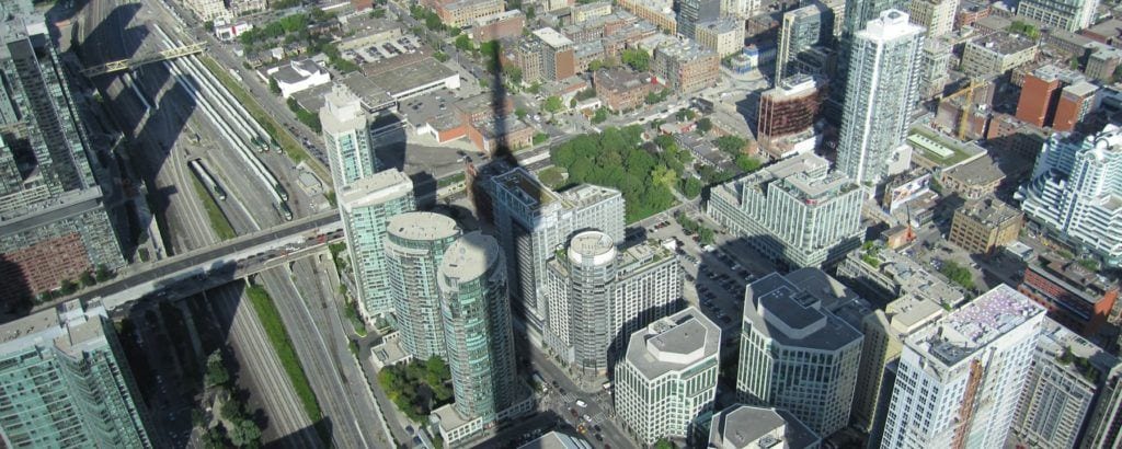 Looking down at the shadow of the CN Tower in Toronto