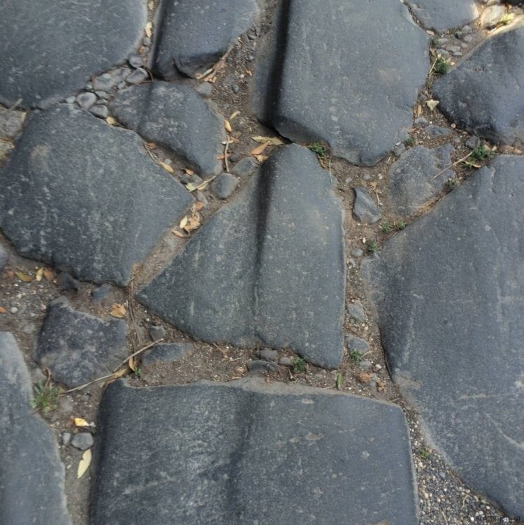 Chariot grooves in Appian Way on our driving tour of Rome with Walks of Italy - tour review from We3Travel.com