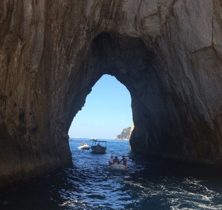 Boating through the Faraglioni Rocks in Capri