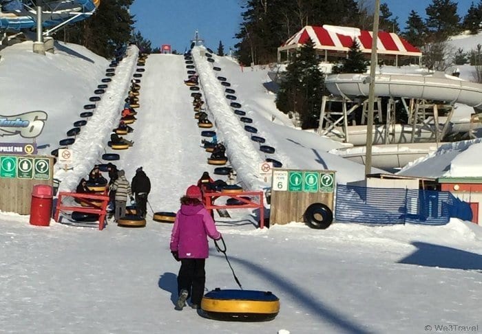 Snow tubing in Quebec at Village Vacanes Valcartier was a perfect winter family fun day. Highly recommended if you are <a href=