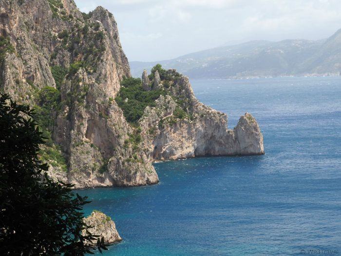 A hike to the Natural Arch in Capri Italy includes views of the arch, the Faraglioni rocks and a stop at the Grotto di Matermania.