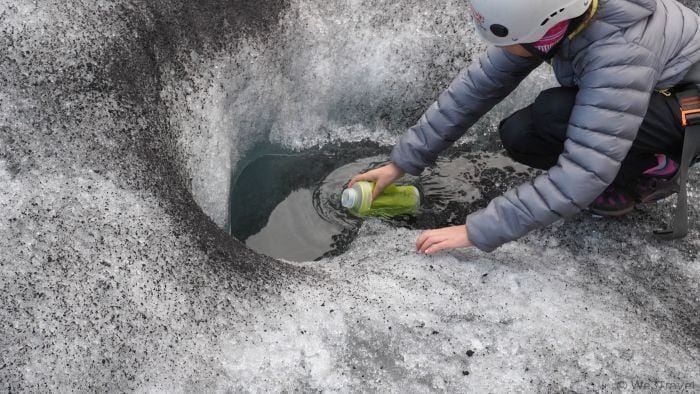 Glacier hiking in Iceland with Arcanum Glacier Tours -- drinking glacial water