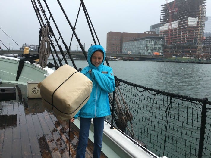 Throwing tea into the water at the Boston Tea Party Ships and Museum