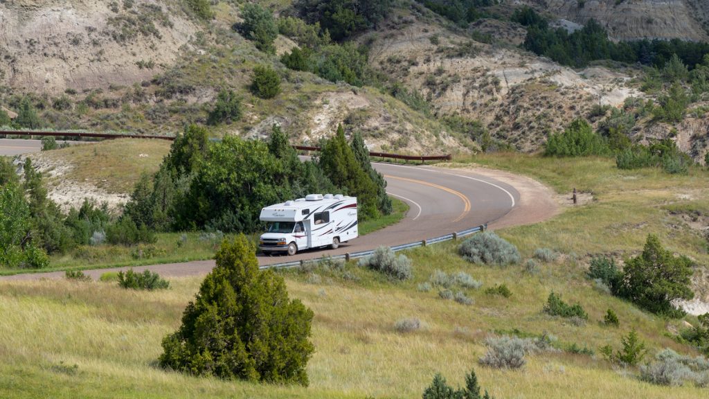 RV on road in Theodore Roosevelt National Park