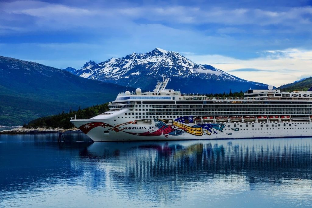 Cruise ship in front of mountain