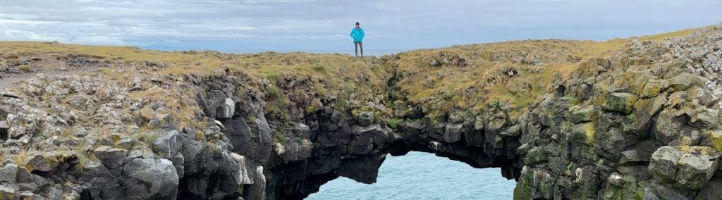 Tamara on the Arnarstapi cliffs land bridge
