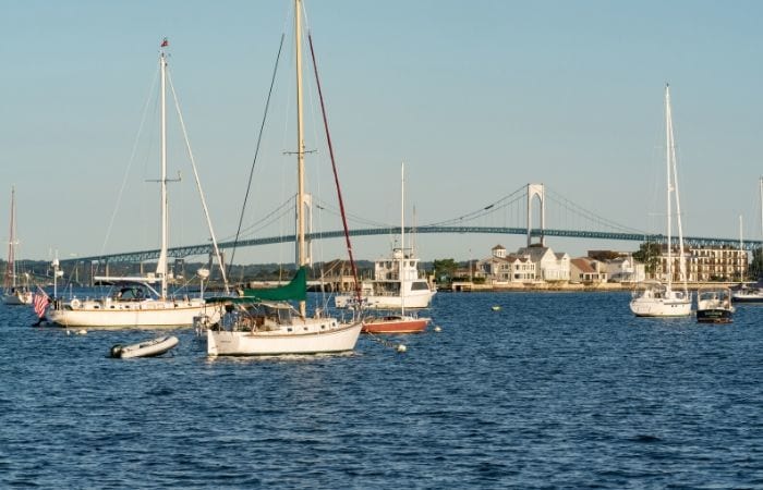 Boats in the harbor in front of Pell Bridge in Newport