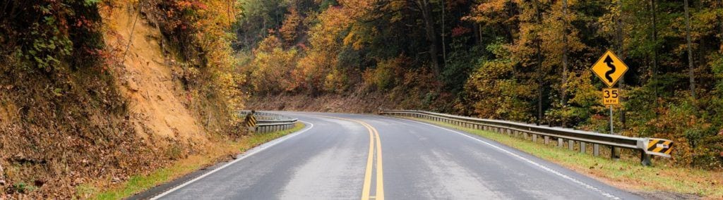 road through mountains in the fall