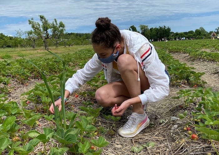 teen strawberry picking