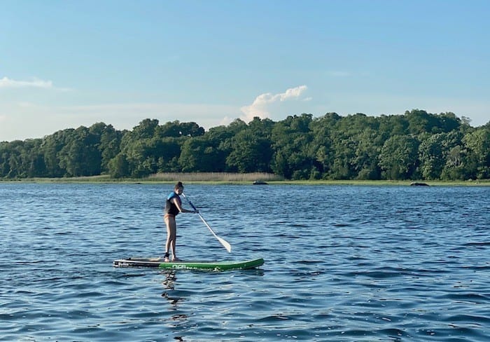 teen paddle boarding