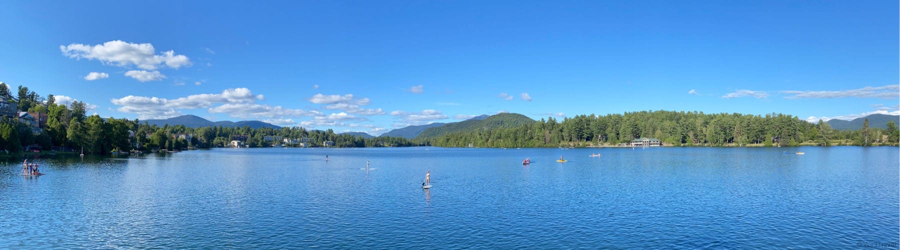 Paddle boards and kayaks on Mirror Lake new york