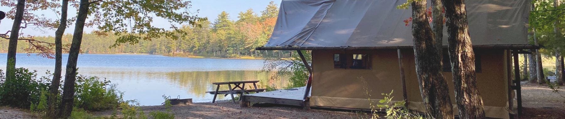 Huttopia White Mountains glamping tent next to the lake