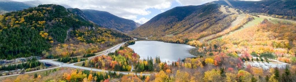 View of Echo Lake and fall leaves in NH from Artists Bluff