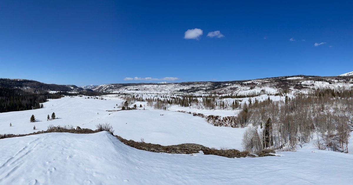 View of snow and mountains from Indian Hill near Steamboat Springs, Colorado