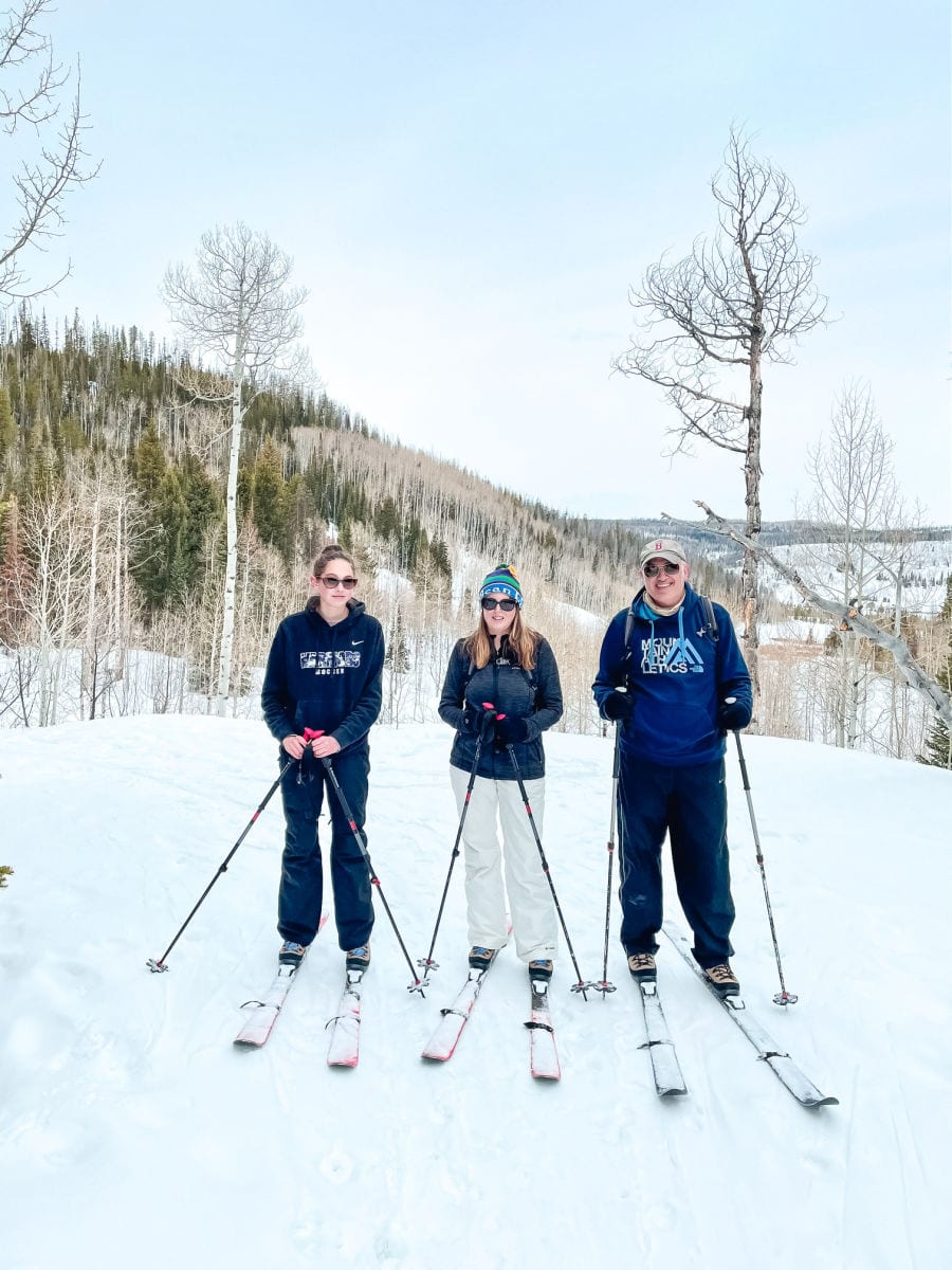 Family on cross country skis in the snow