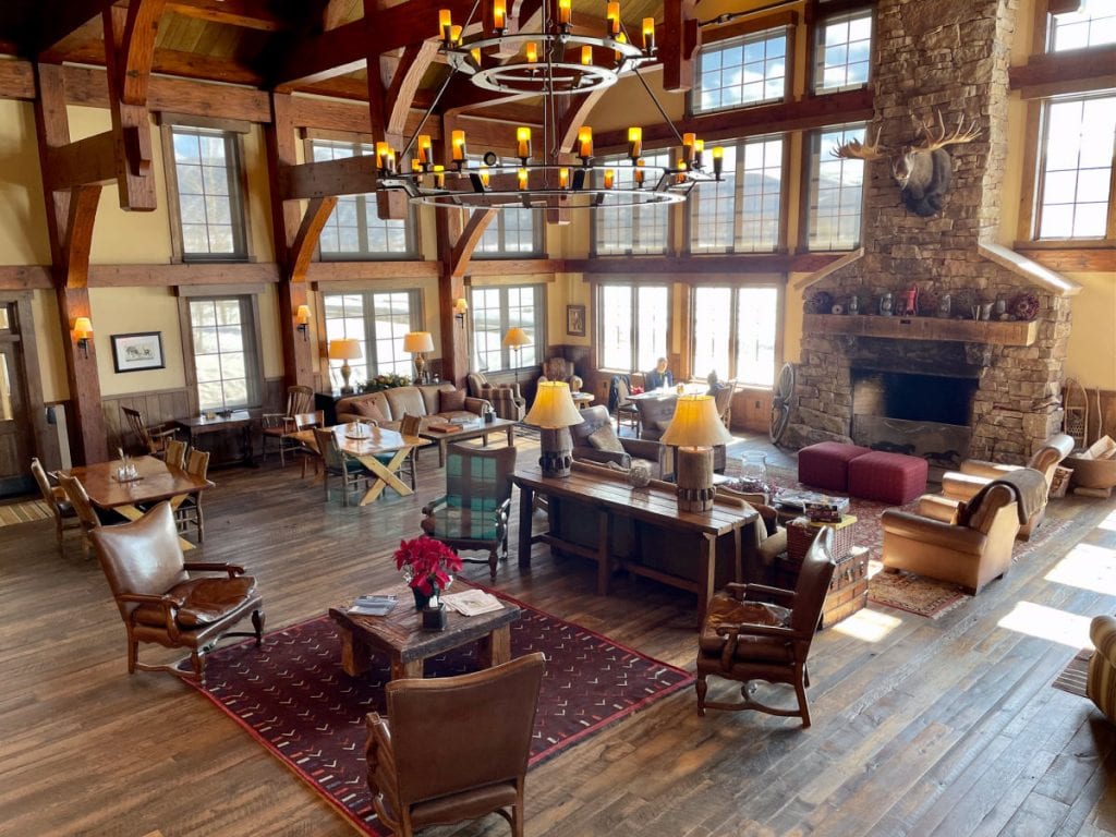 Vista Verde Ranch lodge main room with sofas and fireplace