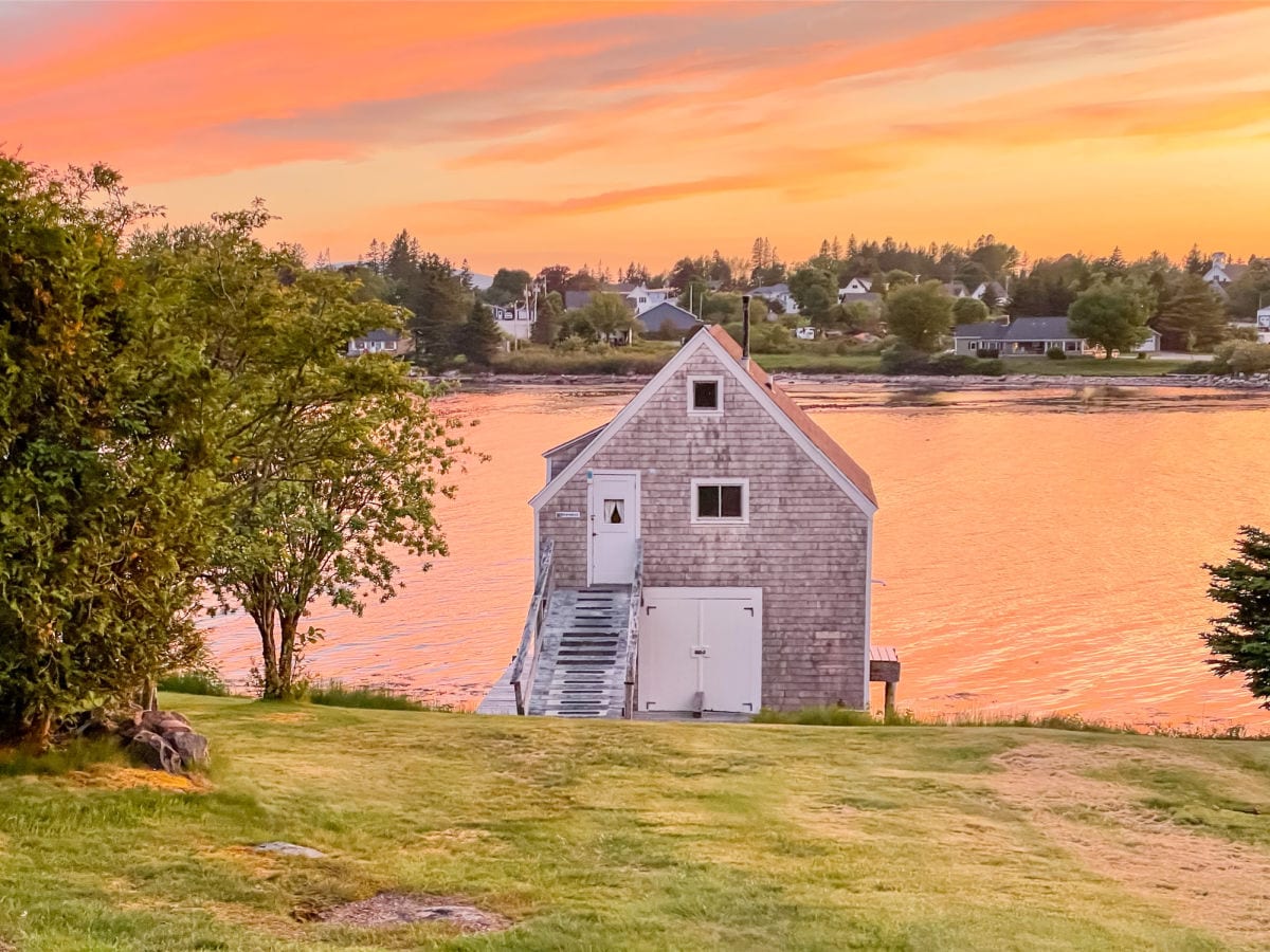 Boathouse at MainStay Cottages and RV park in Winter Harbor Maine at sunset