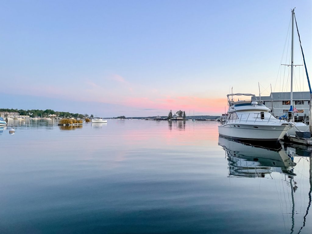 Boats on the water in Boothbay Harbor at sunset