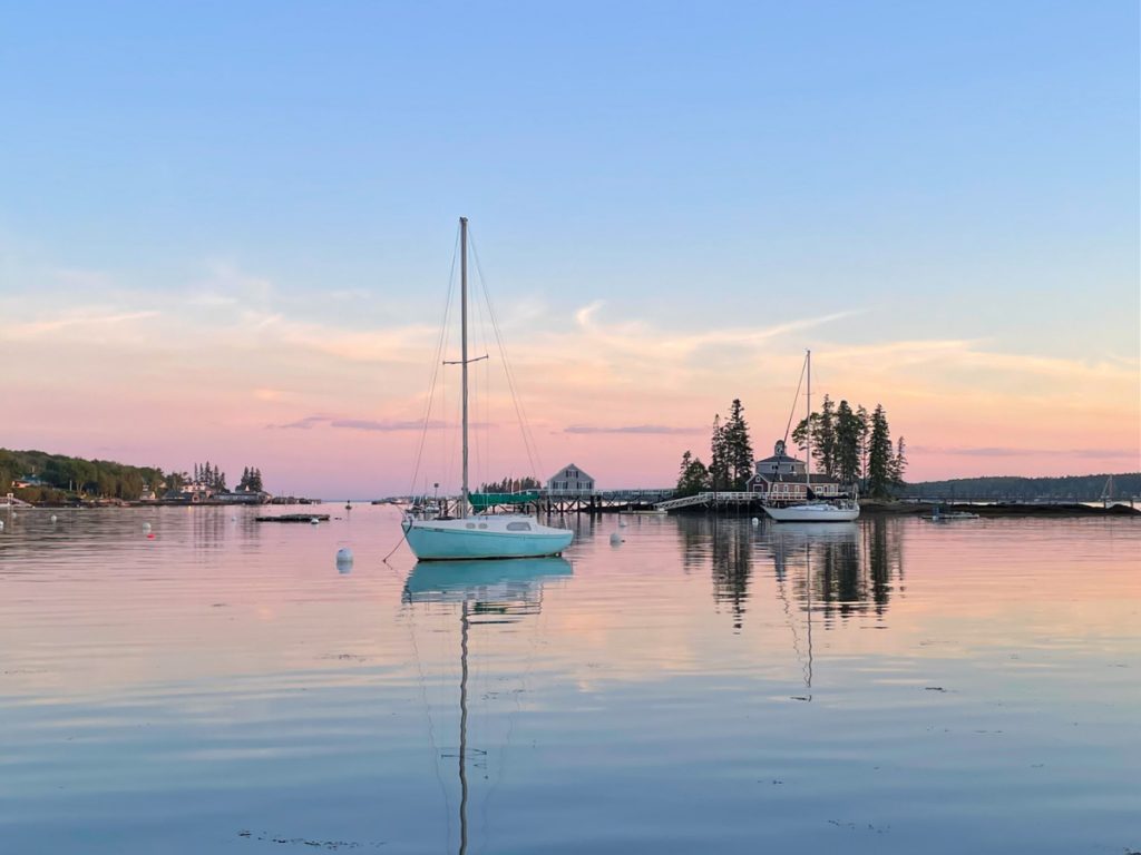 Sailboat on the water in Boothbay Harbor at sunset