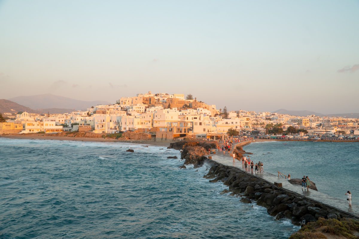 Naxos town from Apollo Temple with path across water at sunset