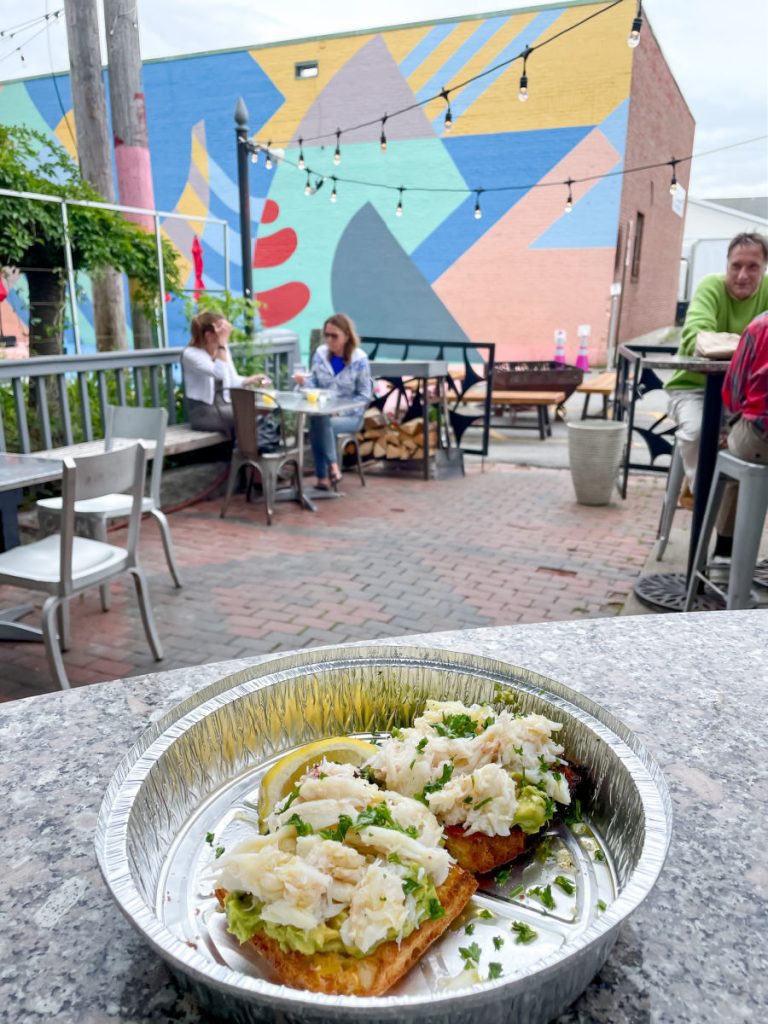 Crab toast on outdoor patio at Cafe Miranda