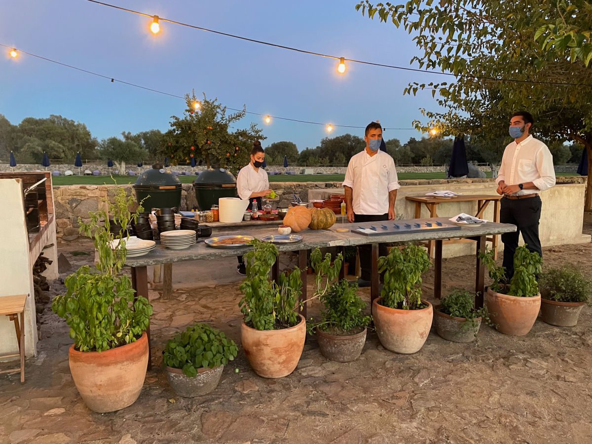 Outdoor grill area with servers at Sao Lourenco do Barrocal