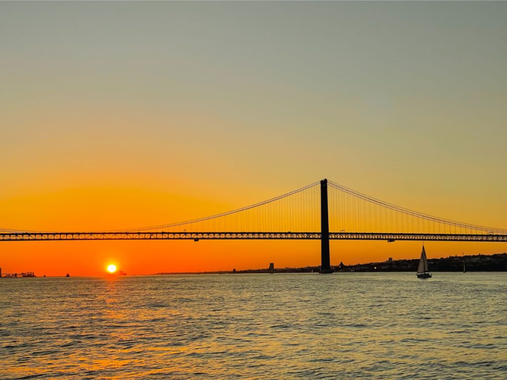Bridge over river Tagus in Lisbon at sunset