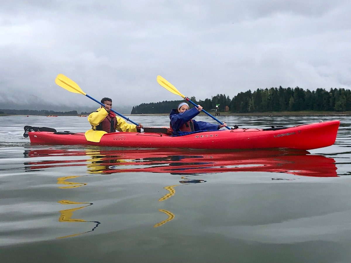 girl and guy in a red kayak