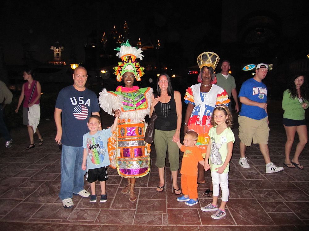 family with Bahamian dancers