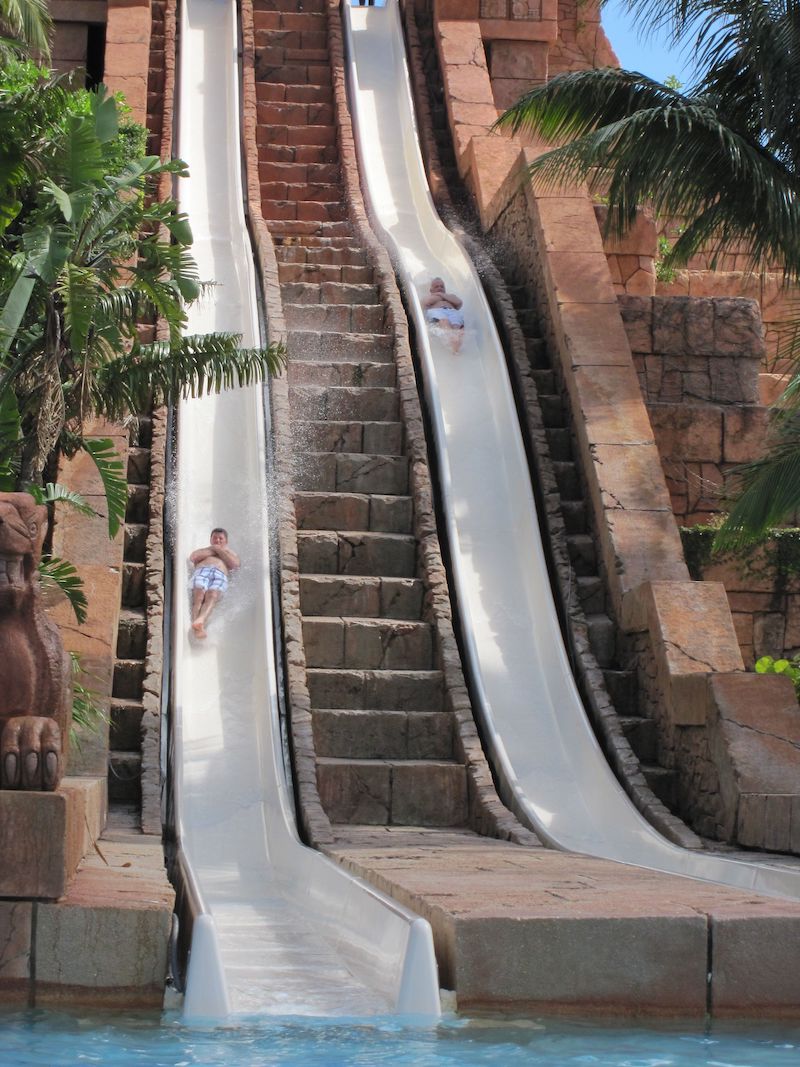 2 men on water slide