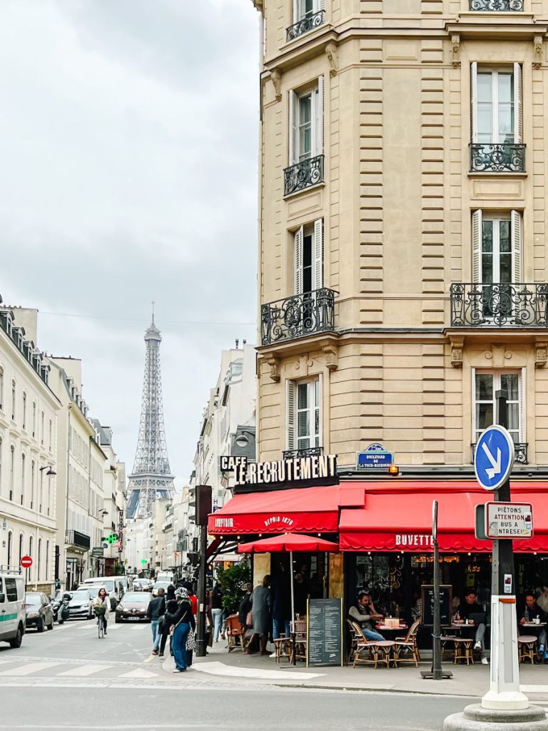 Le Recrutement Cafe with Eiffel tower in the background