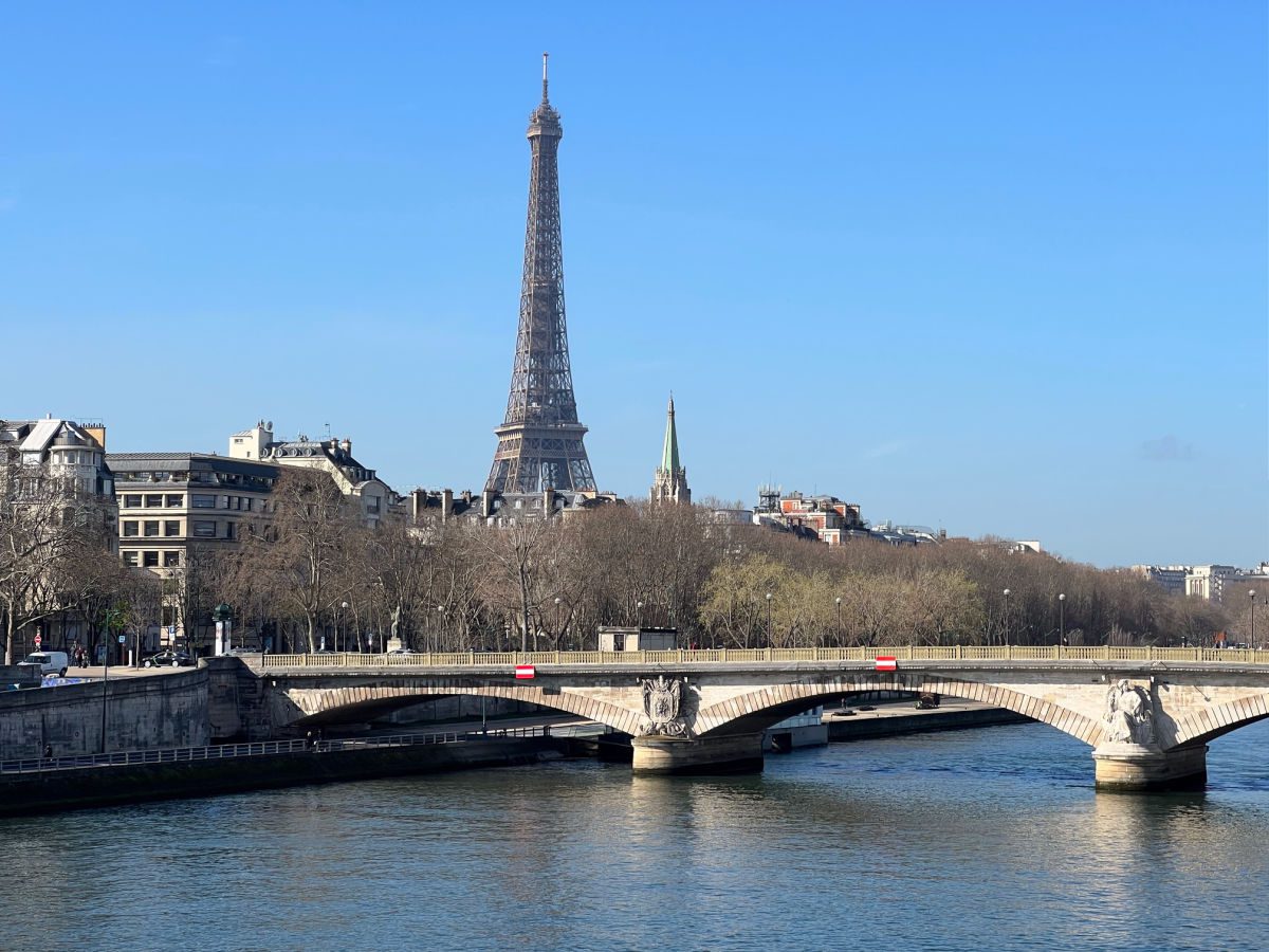 Alexander III bridge over the Seine River with the Eiffel Tower in the background