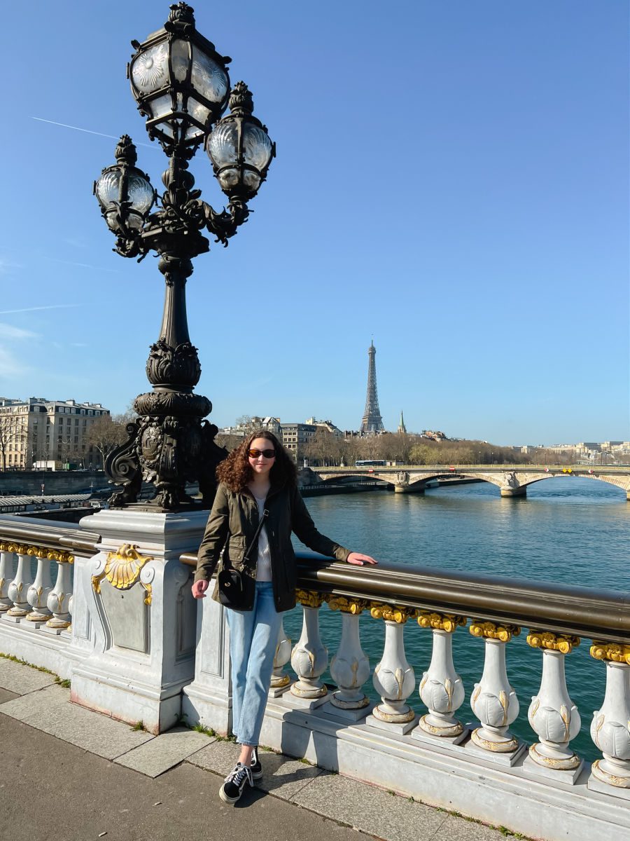 Girl on Alexander III Bridge with the Eiffel Tower in the background