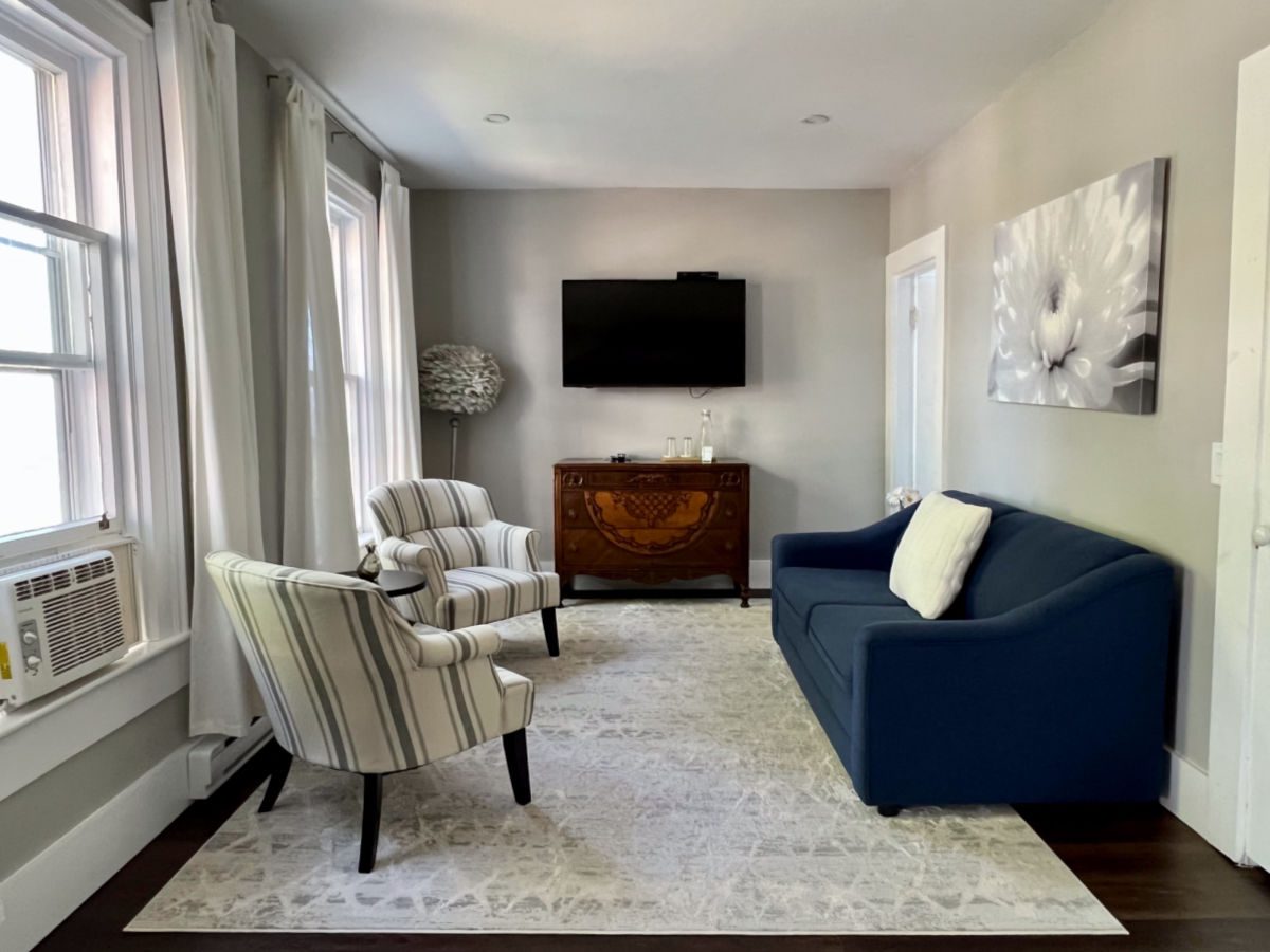 Moran room sitting area with couch and chairs at the Beach Street Inn