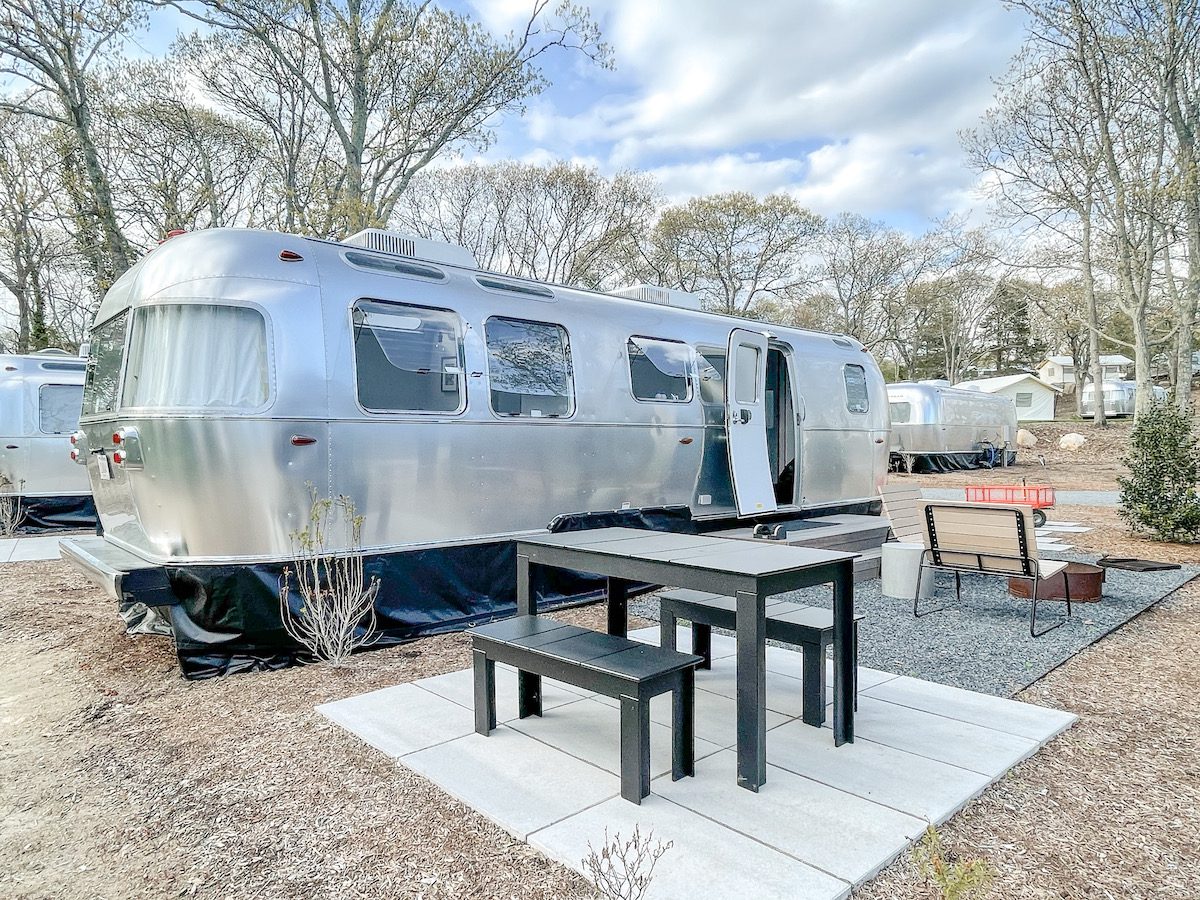 Airstream trailer and picnic area at Auto Camp Cape Cod