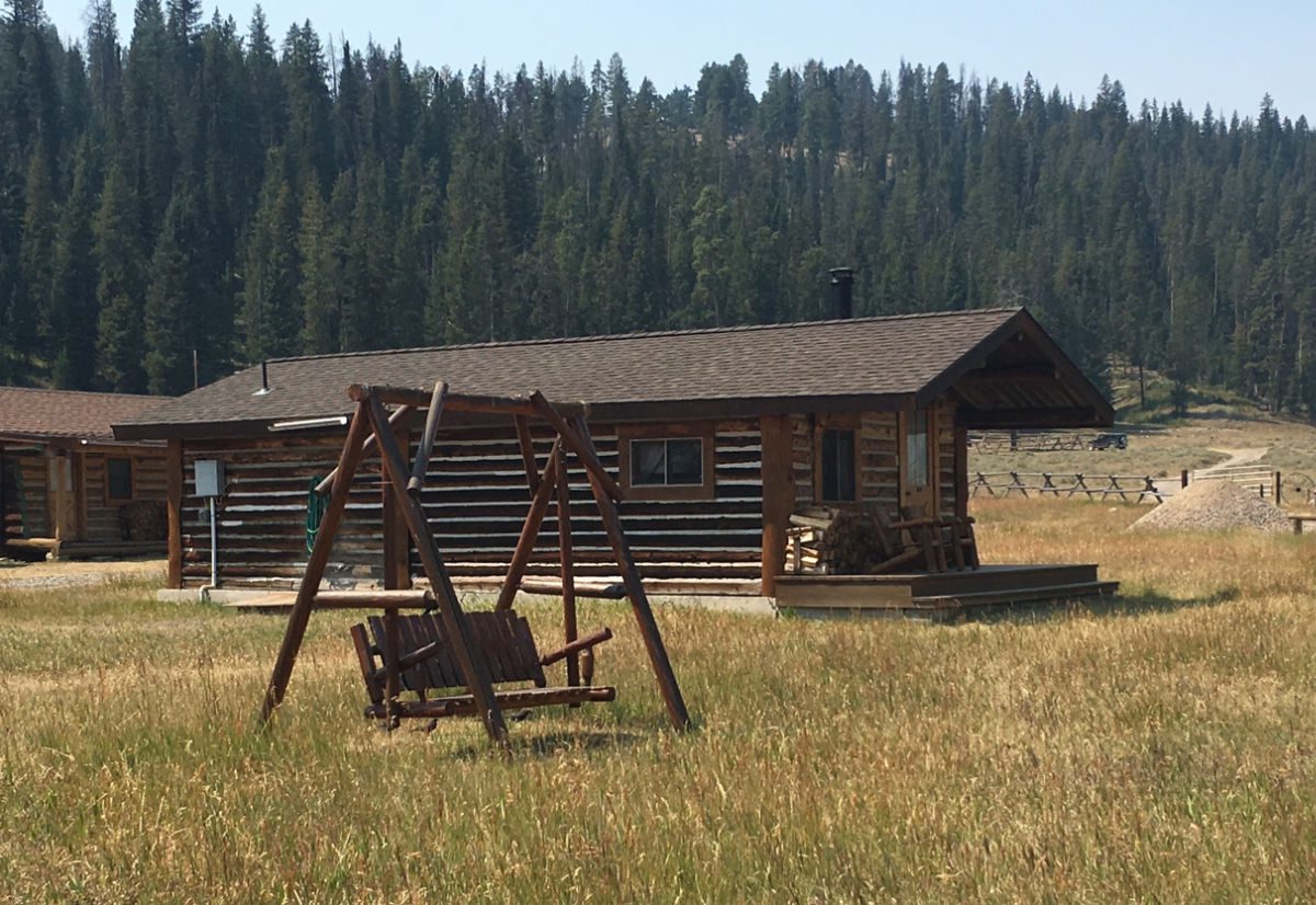 cabin and swing at Nine Quarter Circle Ranch