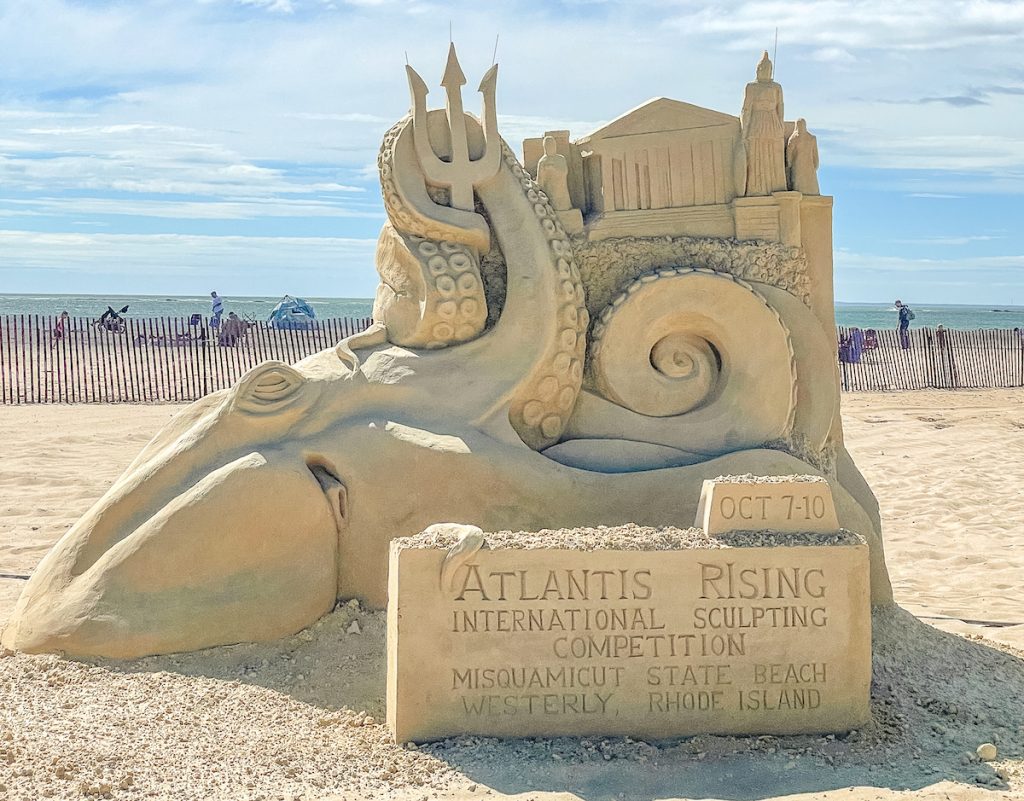 Atlantis Rising sand sculpture with an octopus and poseidon fork