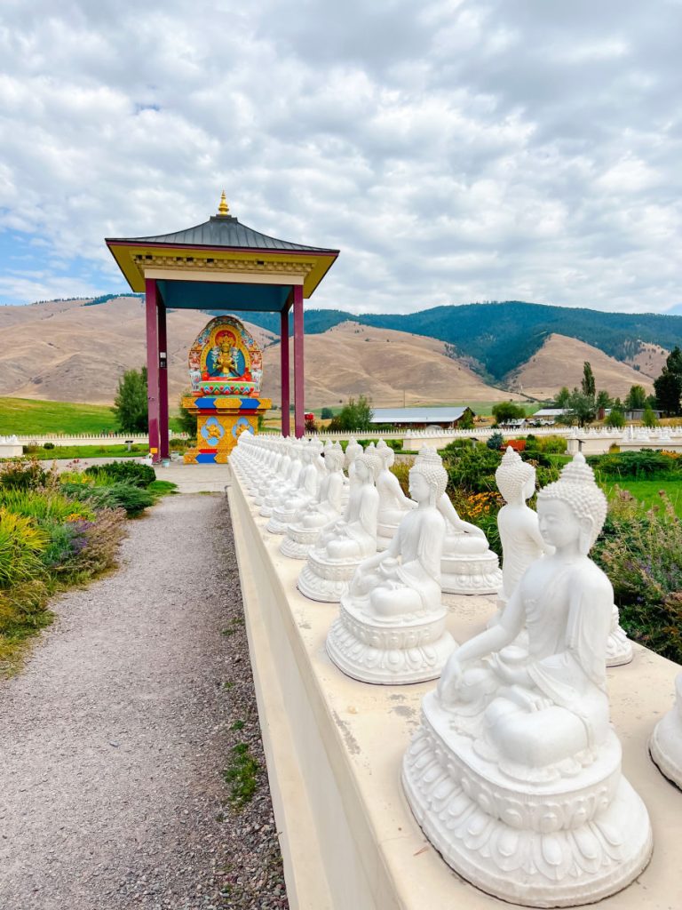 Garden of 1000 Buddhas with line of buddhas leading to main buddha shrine