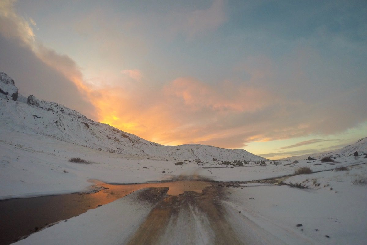 Sunset over snow covered mountains in Iceland