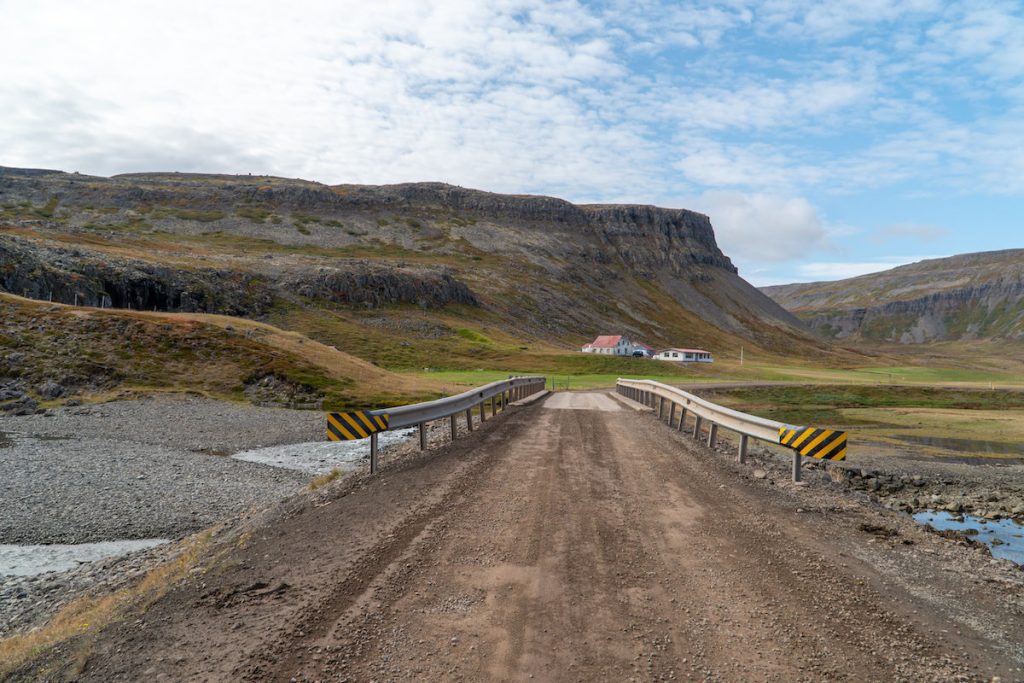 gravel road and bridge in the westfjords