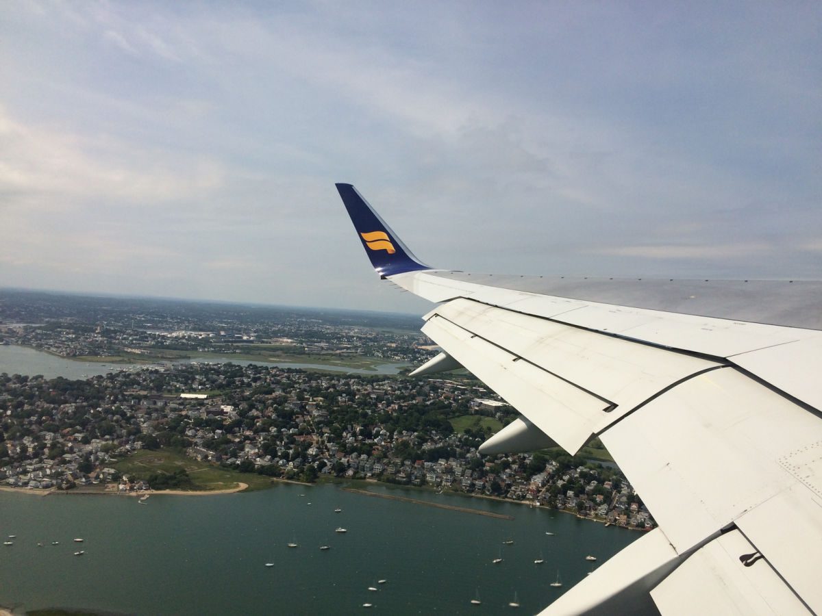 wing of Iceland Air plane over Boston