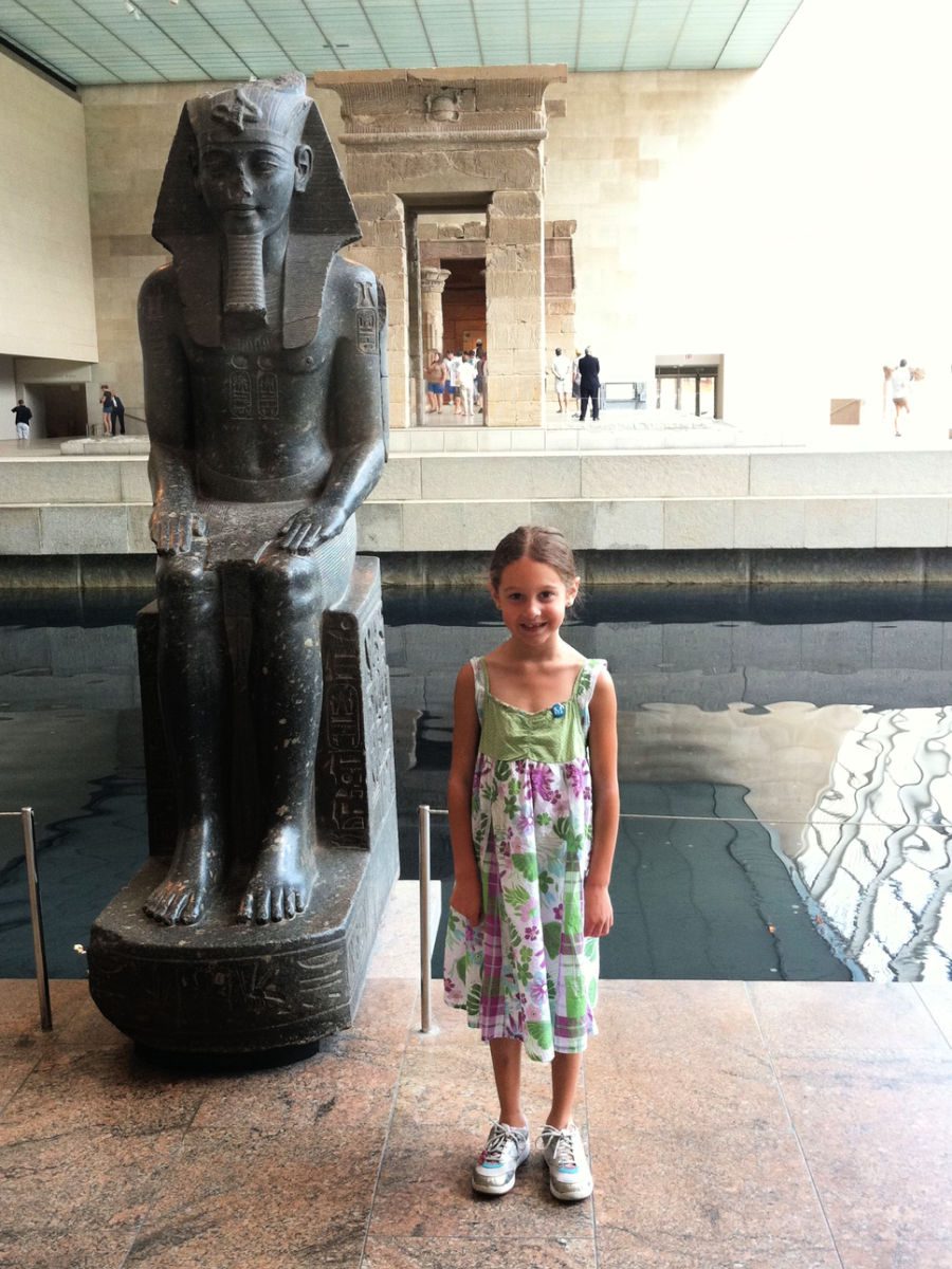 Girl in front of Egyptian room at the Met