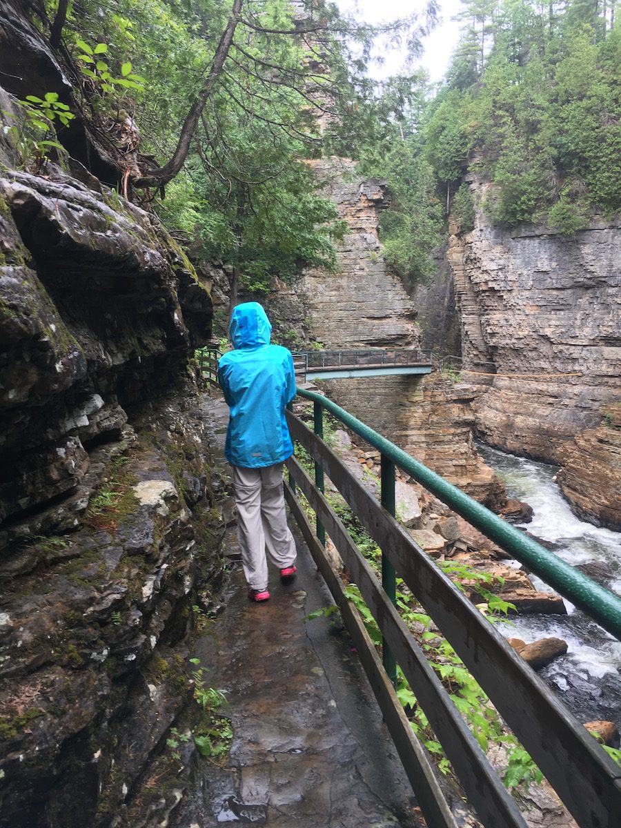 girl walking on inner sanctum trail at Ausable Chasm