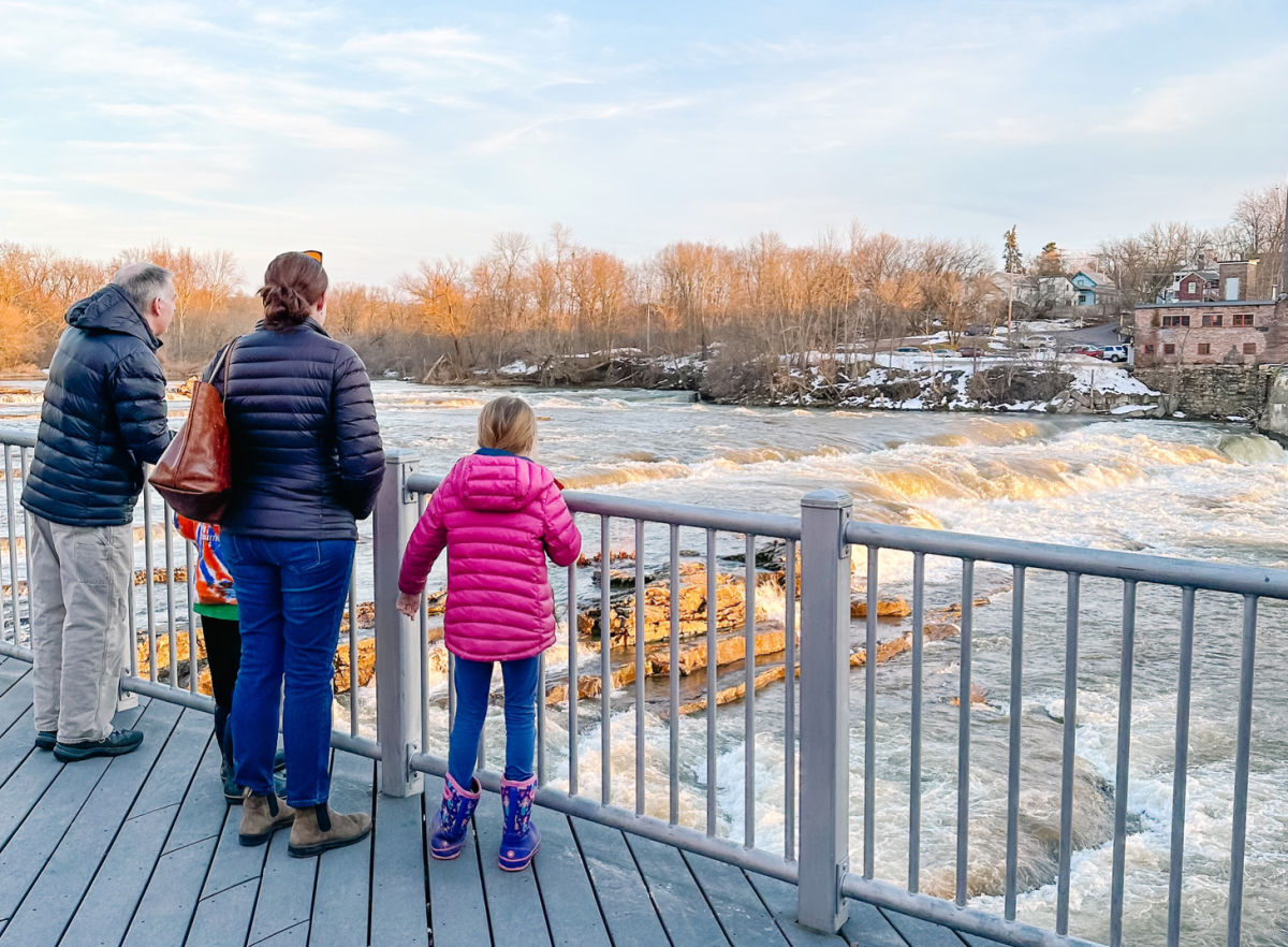 Winooski Falls with a family at overlook