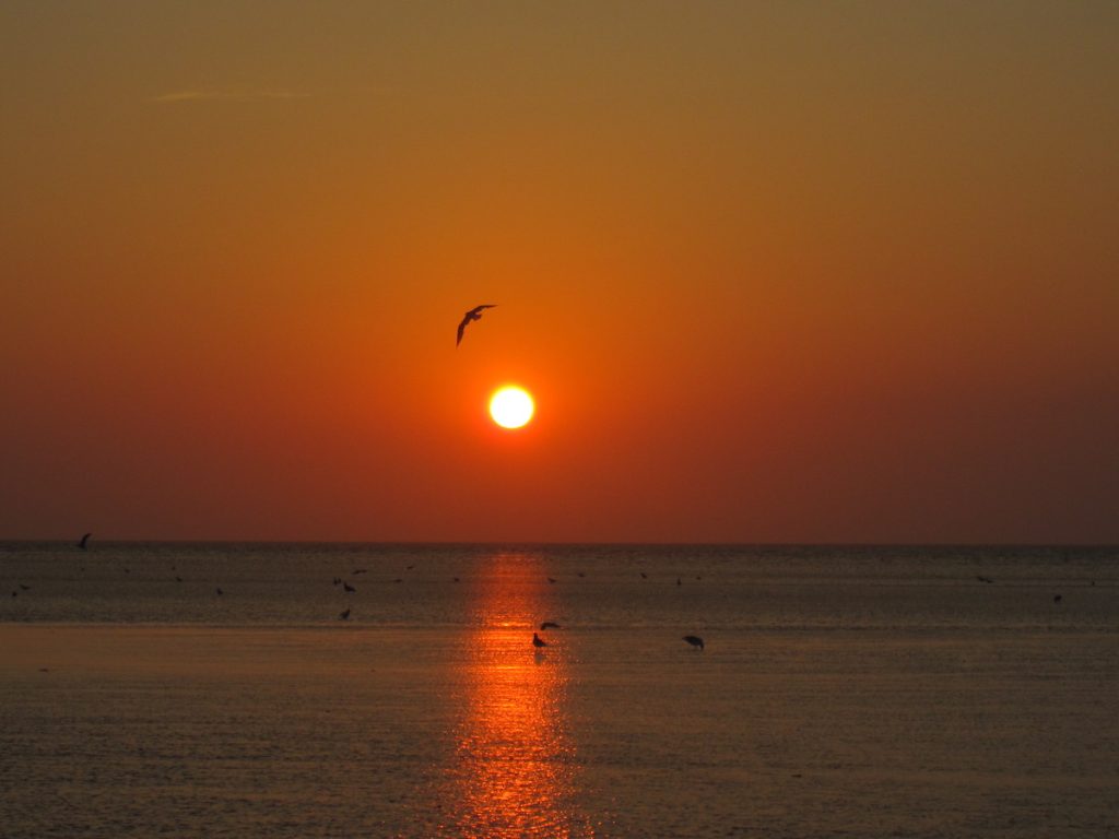 Sunset over the water at Skatet Beach