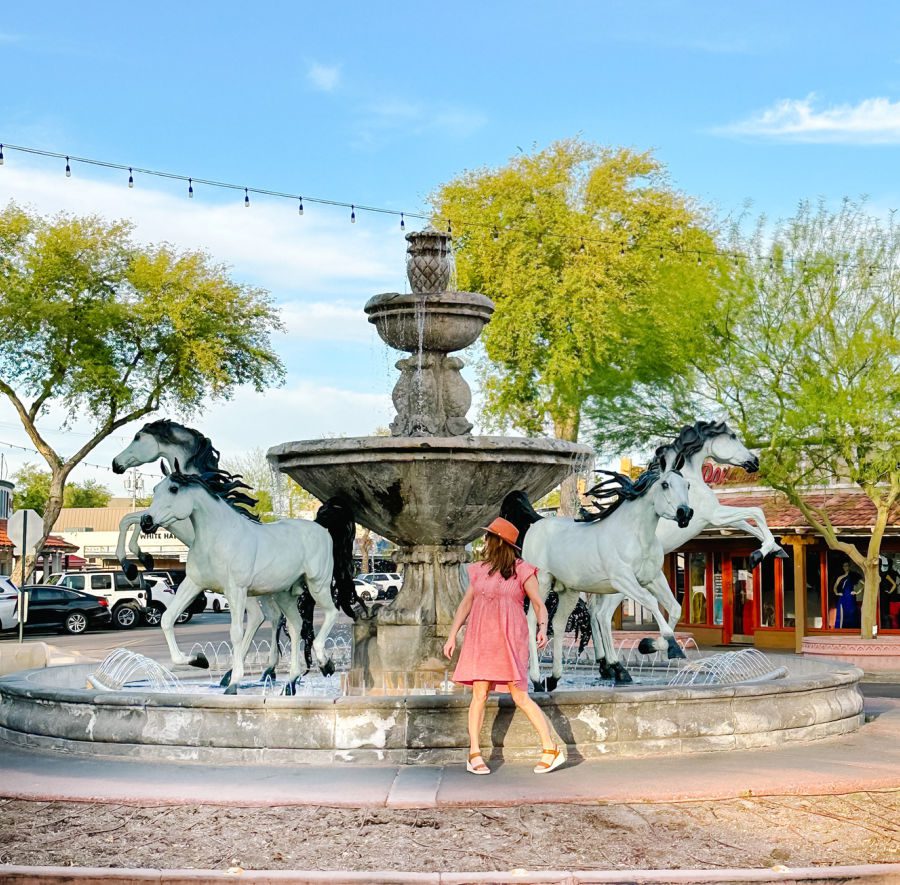 Tamara in front of horse fountain in Old Town Scottsdale