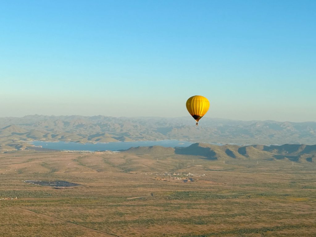 Hot air balloon over lake in Scottsdale