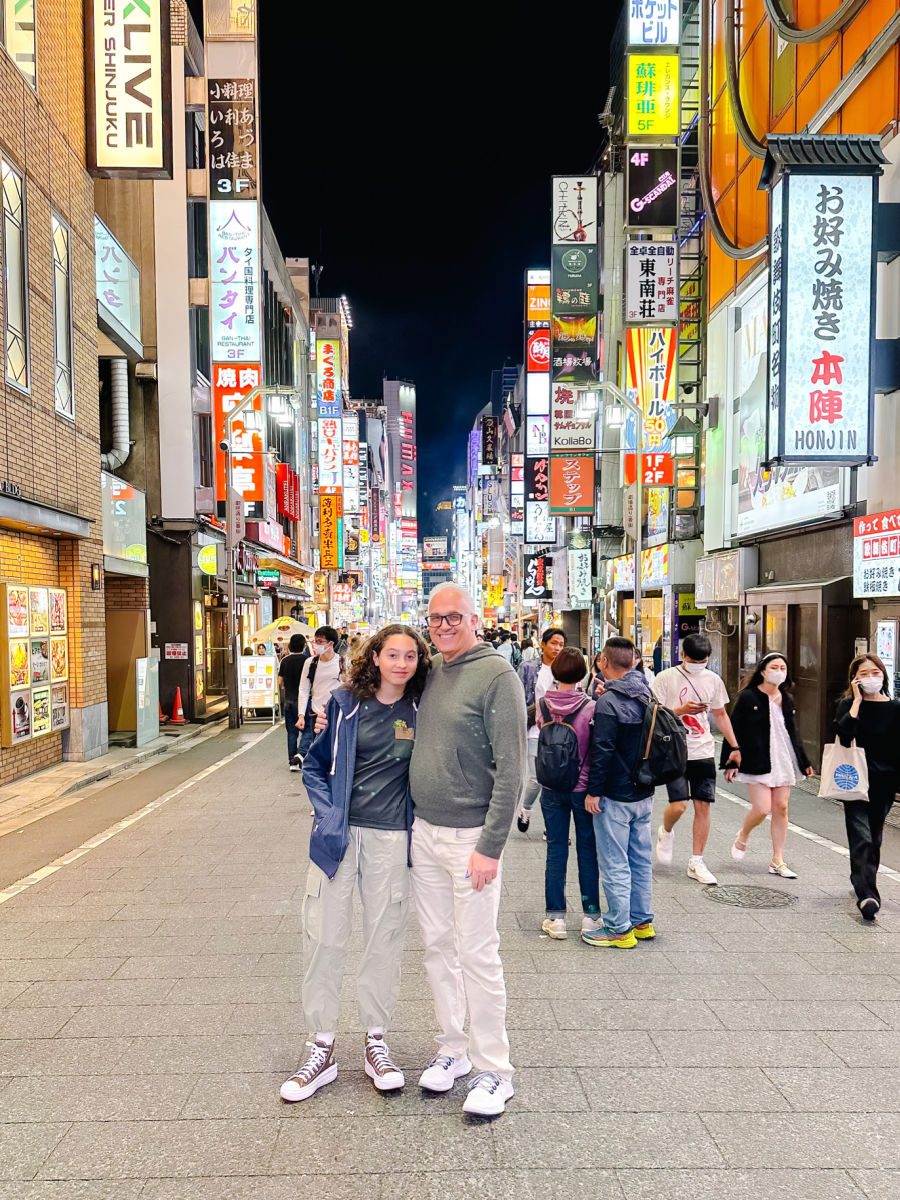 Father and daughter on the streets of Shinjuku at night