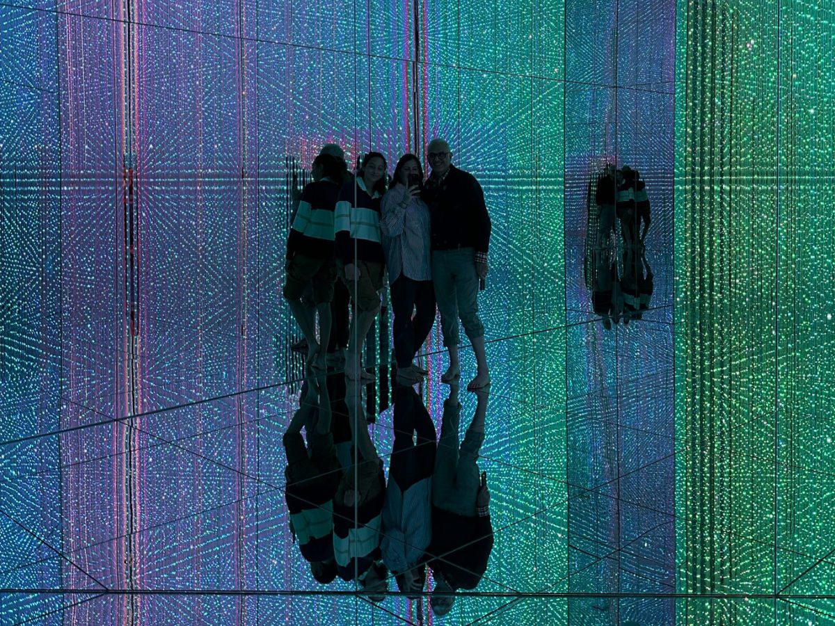 Family in crystal reflection room at Team lab Planets Tokyo