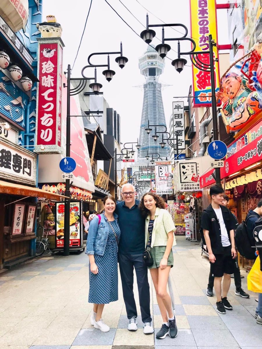 Family in front of the Tsutenkaku tower in Shinsekai